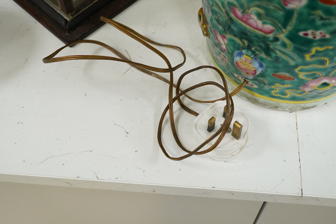 A late 19th century Chinese enamelled porcelain green ground vase with relief decoration, mounted as a lamp, 48cm high overall